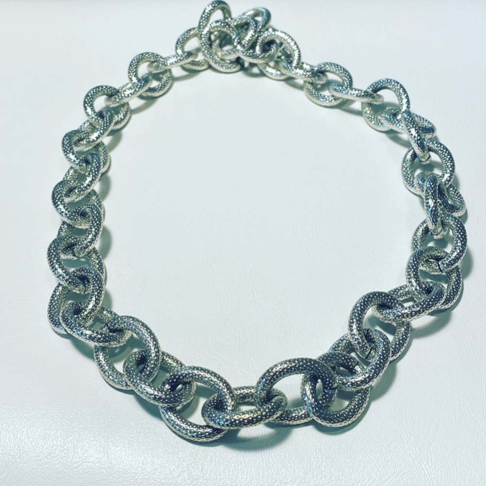 Big and chunky and fabulous silver toned necklace gem